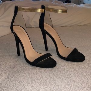 Black and gold heels
